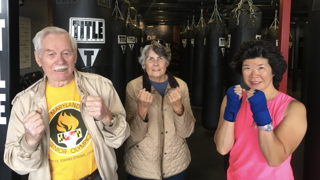 Three people boxing